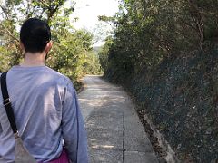 12A Walking along the paved trail toward Big Wave Bay on Dragons Back hike Hong Kong